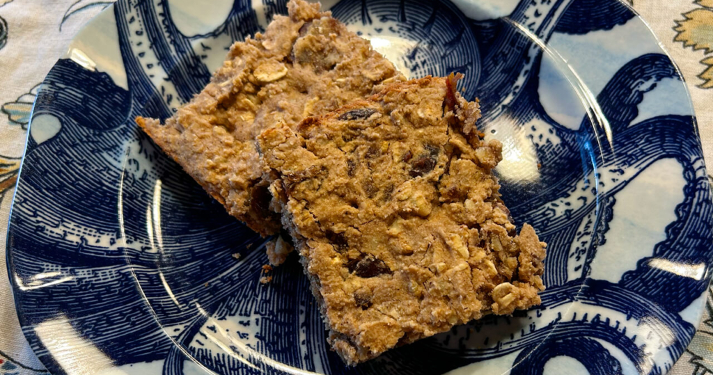 2 date nut bars sitting on a plate