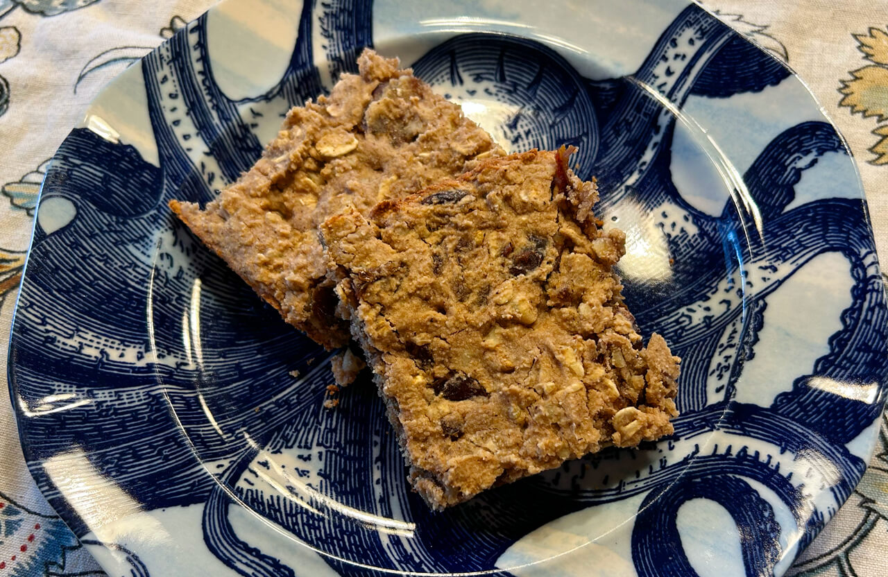 2 date nut bars sitting on a plate